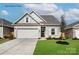 Charming single-Gathering home features a two-car garage, stone accents, and well-maintained landscaping at 1650 Troon Dr, Salisbury, NC 28144