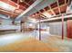 Unfinished basement with concrete flooring and exposed beams offers a blank canvas for creating additional living space at 167 Cedar Ln, Troutman, NC 28166