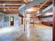 Unfinished basement with exposed beams and concrete flooring, providing ample space for storage or future customization at 167 Cedar Ln, Troutman, NC 28166