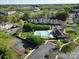 An aerial view of the community, showing the pool, tennis courts, and surrounding landscaping at 17143 Red Feather Dr, Charlotte, NC 28277