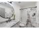 Clean bathroom featuring a shower/tub combo and granite vanity at 17143 Red Feather Dr, Charlotte, NC 28277