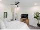 Spacious bedroom featuring a ceiling fan and mounted television at 17143 Red Feather Dr, Charlotte, NC 28277