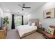 Bright bedroom with a ceiling fan and a large window providing natural light at 17143 Red Feather Dr, Charlotte, NC 28277