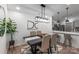 Dining room with modern lighting, bar seating and an open view to the kitchen at 17143 Red Feather Dr, Charlotte, NC 28277