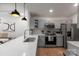 Modern kitchen features stainless steel appliances, gray cabinets, and sleek countertops at 17143 Red Feather Dr, Charlotte, NC 28277