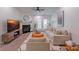 Bright living room featuring a cozy fireplace, ample seating, and stylish decor with modern accents at 17143 Red Feather Dr, Charlotte, NC 28277