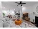 Open-concept living space featuring a living room, dining area, and kitchen with modern finishes and ample lighting at 17143 Red Feather Dr, Charlotte, NC 28277