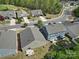 Aerial view of homes with backyard patios, play area, and proximity to street at 1718 Still River Way, Fort Mill, SC 29708