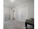 Carpeted bedroom painted a modern neutral color with a large double door closet and wire shelving for storage at 1718 Still River Way, Fort Mill, SC 29708