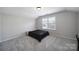 Bedroom with carpet, light walls, a ceiling light, and a window at 1718 Still River Way, Fort Mill, SC 29708