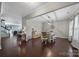 Open dining room with hardwood floors and elegant lighting, adjacent to the home's living spaces at 1718 Still River Way, Fort Mill, SC 29708