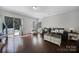 Bright living area featuring hardwood floors, a sliding glass door, and comfortable furnishings at 1718 Still River Way, Fort Mill, SC 29708