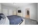 Bright bedroom featuring carpet, neutral paint, ample storage, and an en-suite bathroom at 1718 Still River Way, Fort Mill, SC 29708