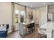 Elegant dining area adjacent to the kitchen with natural light and modern decor at 1726 Braemar Village Dr, Monroe, NC 28110