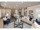 Open-concept living room features modern decor, comfortable seating, and seamless flow to the kitchen and dining area at 1726 Braemar Village Dr, Monroe, NC 28110