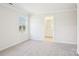 Bright bedroom with neutral walls, carpet, and a window allowing ample natural light at 1741 Braemar Village Dr, Monroe, NC 28110