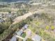 Expansive aerial shot of a home located on a golf course with lush trees and beautiful surroundings at 1849 Oakmont Dr, Denver, NC 28037