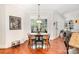 Charming breakfast nook area with natural light, hardwood floors, and views of the landscaped backyard at 1849 Oakmont Dr, Denver, NC 28037