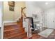 Inviting entryway with hardwood floors, staircase and sitting bench at 1849 Oakmont Dr, Denver, NC 28037