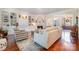 Cozy living room featuring a fireplace, built-in shelving, and comfortable seating for relaxing or entertaining at 1849 Oakmont Dr, Denver, NC 28037