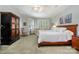 Large primary bedroom featuring a sitting area and many bright windows with shutters at 1849 Oakmont Dr, Denver, NC 28037