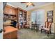 Office room featuring built in shelves and wood desk and trim at 1849 Oakmont Dr, Denver, NC 28037