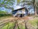 Charming blue home featuring white trim and a wooden deck with stairs, creating a welcoming outdoor space at 1903 Marshall Ave, Gastonia, NC 28052