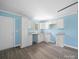 Bright kitchen features granite countertops and white cabinets with ample storage at 1903 Marshall Ave, Gastonia, NC 28052