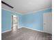 Bright living room offers an open space with neutral walls and hardwood floors at 1903 Marshall Ave, Gastonia, NC 28052