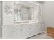 Spacious bathroom vanity featuring double sinks, marble countertop, and custom cabinetry at 19040 Mary Ardrey Cir, Cornelius, NC 28031