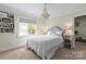 Inviting bedroom with a chandelier, lots of natural light, and neutral decor at 19040 Mary Ardrey Cir, Cornelius, NC 28031