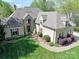 Aerial view of an impressive home with stone accents and manicured landscaping at 19040 Mary Ardrey Cir, Cornelius, NC 28031