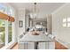 Bright kitchen featuring a long kitchen island with seating for eight at 19040 Mary Ardrey Cir, Cornelius, NC 28031