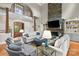 Inviting living room features a stone fireplace, high ceilings, and ample seating at 19040 Mary Ardrey Cir, Cornelius, NC 28031