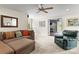 Spacious living room featuring comfortable seating, neutral colors, and an open doorway to the backyard at 19040 Mary Ardrey Cir, Cornelius, NC 28031