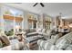 Spacious living room featuring hardwood floors, neutral paint, a ceiling fan, and access to an open concept kitchen at 19040 Mary Ardrey Cir, Cornelius, NC 28031