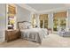 Serene primary bedroom with lake views, natural light, neutral color scheme, and plush furnishings, creating a relaxing retreat at 19040 Mary Ardrey Cir, Cornelius, NC 28031