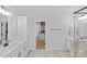 En suite bathroom with dual sink vanity, modern cabinetry, a walk-in closet, and shower at 2017 Autumn Dr, Monroe, NC 28110