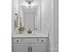 Bathroom features a vanity with white cabinetry and granite countertop plus bronze plumbing fixtures at 2017 Autumn Dr, Monroe, NC 28110