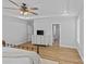 Spacious bedroom with a dresser, flat screen TV, and shuttered windows with a view into the bathroom at 2017 Autumn Dr, Monroe, NC 28110