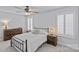 Comfortable bedroom with ceiling fan, two windows, and stylish furniture at 2017 Autumn Dr, Monroe, NC 28110
