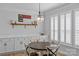 Charming breakfast nook with built-in cabinets, wainscotting, and natural light from the shuttered windows at 2017 Autumn Dr, Monroe, NC 28110