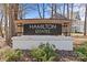 Attractive Hamilton Estates community sign with brick base and wooden frame at 2017 Autumn Dr, Monroe, NC 28110