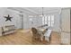 Bright dining area with ample seating, decorative details, and a view of the entrance at 2017 Autumn Dr, Monroe, NC 28110