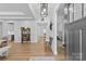 Inviting foyer with hardwood floors, stylish light fixtures, and a view into the living spaces at 2017 Autumn Dr, Monroe, NC 28110