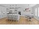 Open-concept kitchen featuring a center island, stainless steel appliances, and an adjacent breakfast nook at 2017 Autumn Dr, Monroe, NC 28110