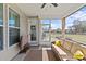 Inviting screened porch with cozy furniture and access to the backyard at 2017 Autumn Dr, Monroe, NC 28110