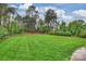 Large, well-maintained backyard with lush green lawn and mature trees at 20635 Queensdale Dr, Cornelius, NC 28031