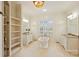 This bathroom features dual vanities, a soaking tub, and an open shelving unit at 20635 Queensdale Dr, Cornelius, NC 28031