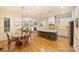 Spacious kitchen with a central island, granite countertops, stainless steel appliances, and a breakfast nook at 20635 Queensdale Dr, Cornelius, NC 28031